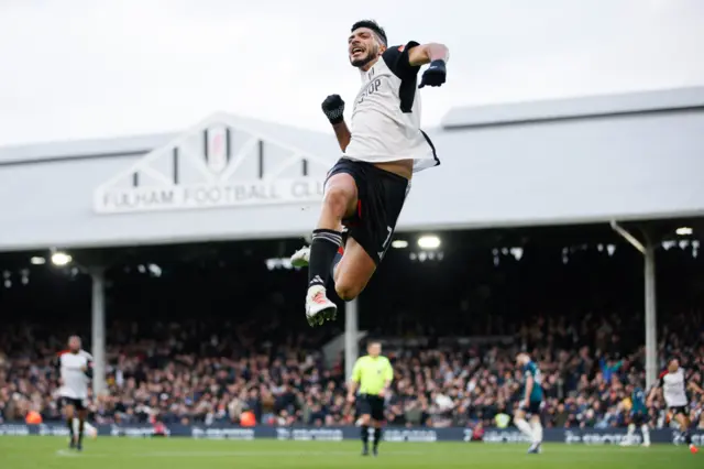 Jimenez cleebrates his goal v Arsenal with a fist bump in the air.