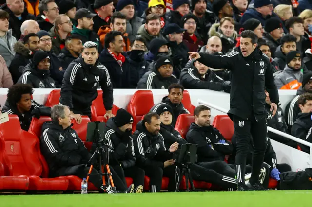 MArco Silva getsures to his subs from his position on the bench.