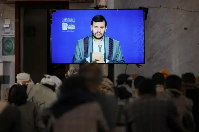 Newly recruited Houthi fighters watch a recorded lecture by the Houthi movement's top leader, Abdul-Malik al-Houthi