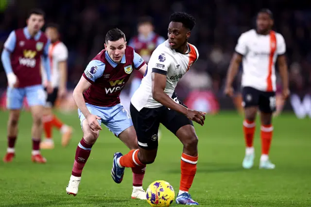 Albert Sambi Lokonga of Luton Town on the ball whilst under pressure from Josh Cullen