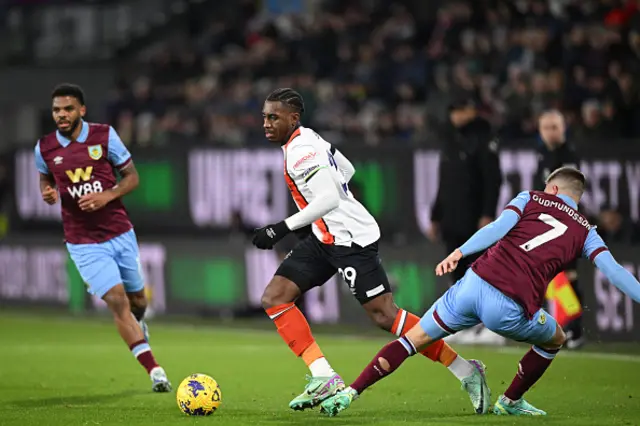 Amari'i Bell vies with Burnley's Johann Berg Gudmundsson