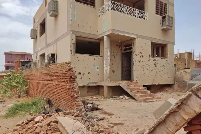 This picture shows a damaged house that was hit by an artillery shell in southern khartoum on June 11, 2023.