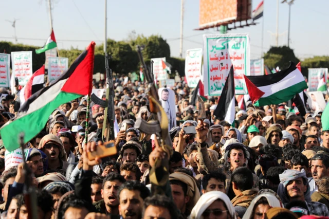 Supporters of the Houthi movement rally to denounce air strikes launched by the US and Britain on Houthi targets