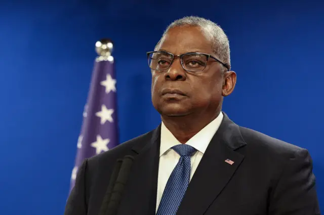 Lloyd Austin in a suit at a press conference