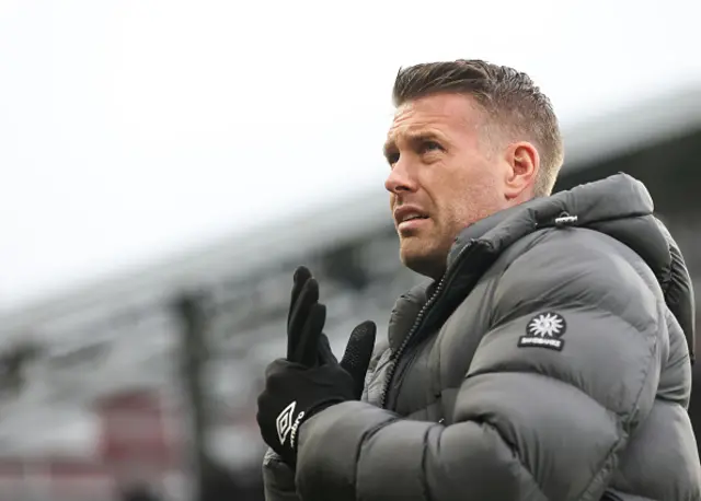 Luton Town manager Rob Edwards looks on