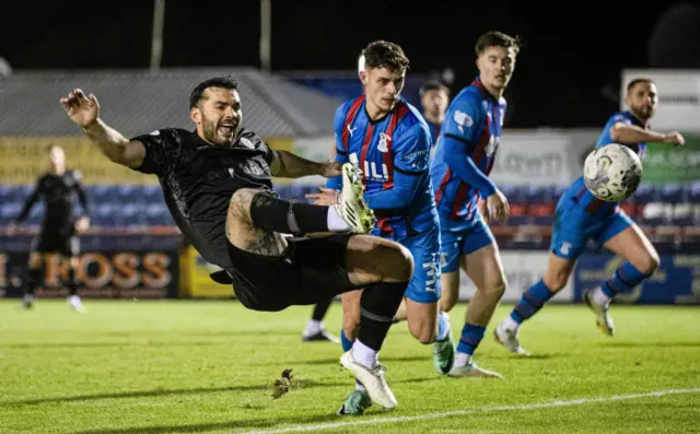 Tony Watt goes down in the Inverness box