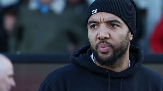 Forest Green manager Troy Deeney looks on from the touchline