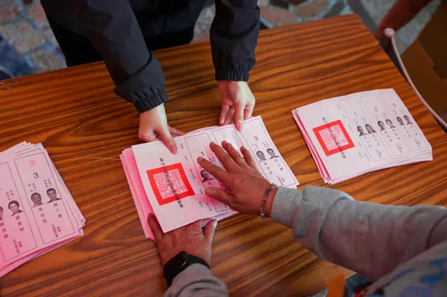 Election workers in Taipei count votes