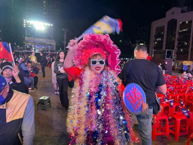 This woman, dressed in tinsel from head to toe, has frequently shown up at KMT rallies