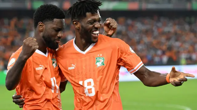 Jean-Philippe Krasso and Franck Kessie celebrate a goal for Ivory Coast