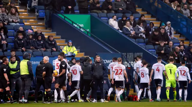 Bolton players leave the field