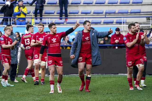 Scarlets players salute their fans