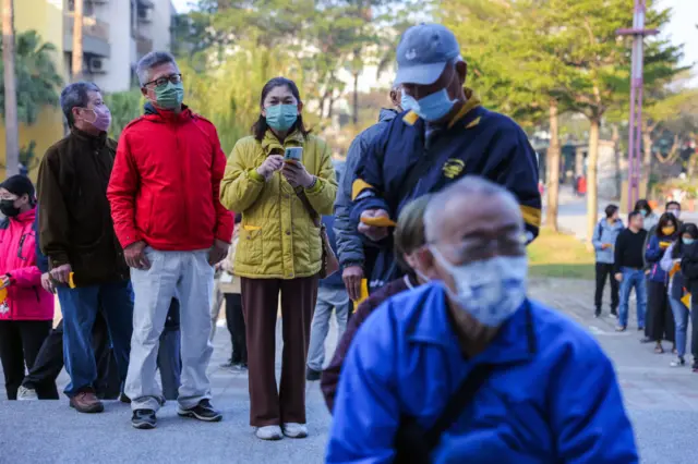 Voters line up to cast their ballots in the presidential election on January 13, 2024 in Tainan,