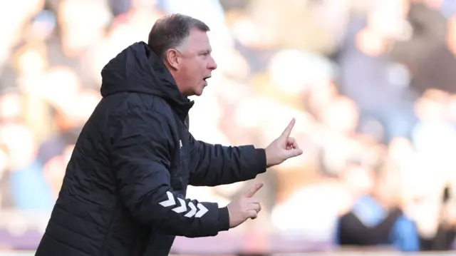 Coventry boss Mark Robins issues instructions from the sidelines