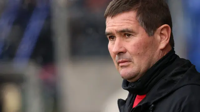 Mansfield manager Nigel Clough stands on the touchline