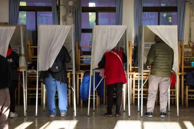 Voters cast their ballots in the presidential election on January 13, 2024 in Taipei, Taiwan.