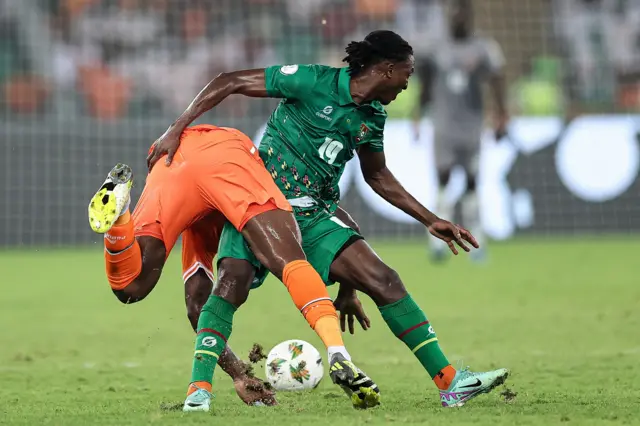 Janio Bikel fights for the ball with Ivory Coast's midfielder Franck Kessie