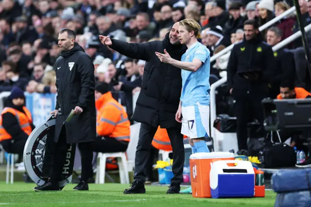 Pep Guardiola and Kevin De Bruyne talking