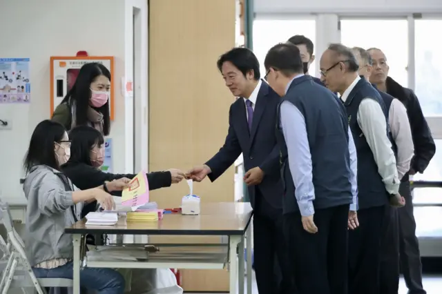 A group of men voting