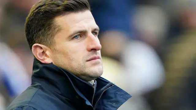 John Mousinho watches his Portsmouth team