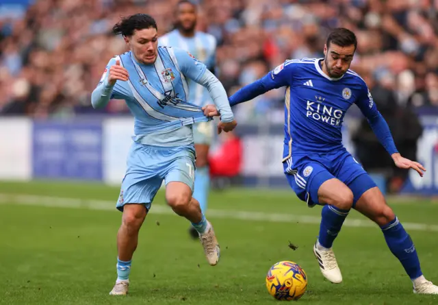 Coventry's Callum O'Hare and Leicester's Harry Winks challenge for the ball