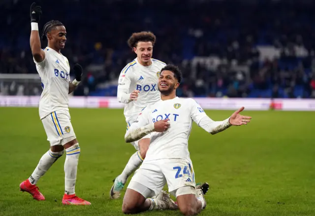 Georgino Rutter celebrates scoring Leeds' third at Cardiff