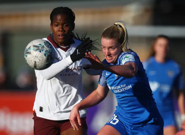 Manchester City's Khadija Shaw in action with Durham's Dee Bradley