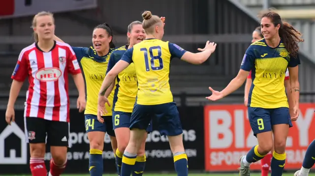 Moneyfields celebrate scoring against Exeter City.