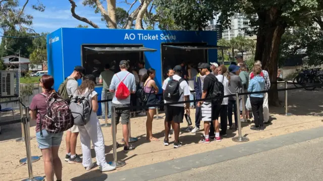 Fans queue at the Australian Open ticket office