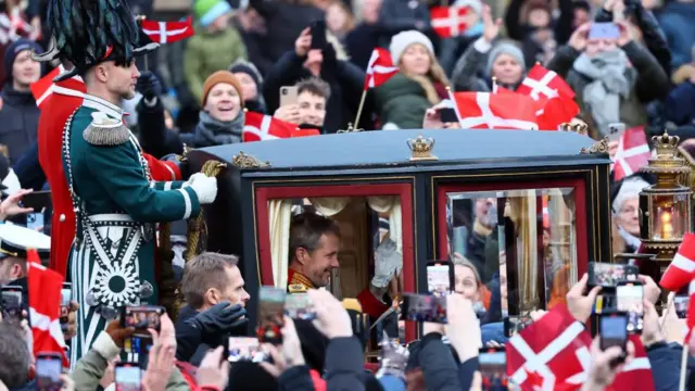 Denmark's newly proclaimed King Frederik sits in a carriage