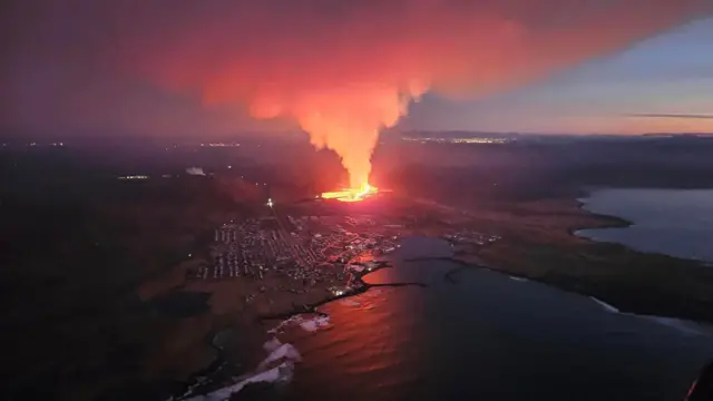 A volcano spews lava and smoke as it erupts in Reykjanes Peninsula, Iceland on 14 January.