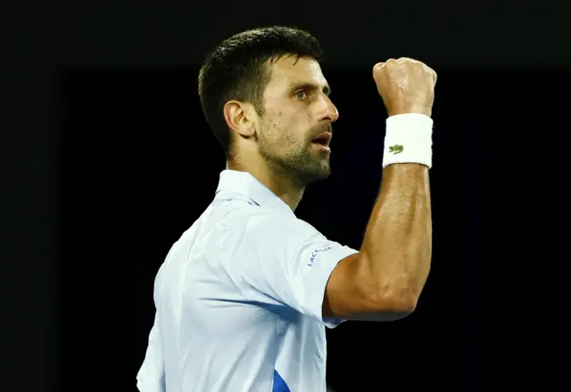 Novak Djokovic pumps his fist in celebration