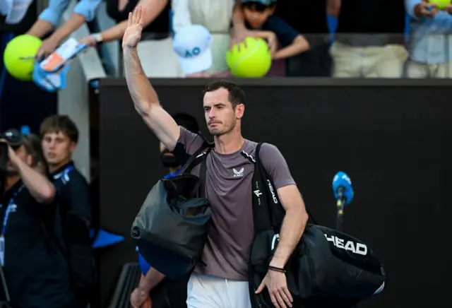 Andy Murray waves to the crowd looking wistful