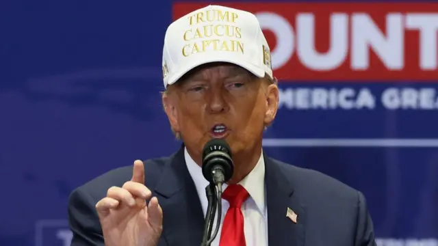 Former U.S. President and Republican presidential candidate Donald Trump speaks as he campaigns in Indianola, Iowa, U.S., January 14, 2024. REUTERS/Brendan McDermid