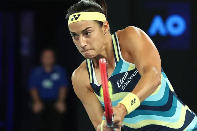 Caroline Garcia hits a backhand shot