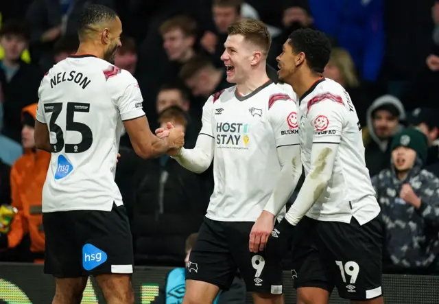 James Collins (centre) celebrates his goal with his Derby County team-mates