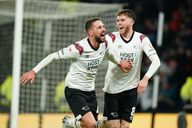 Derby County's Conor Hourihane (left) celebrates his goal against Burton Albion