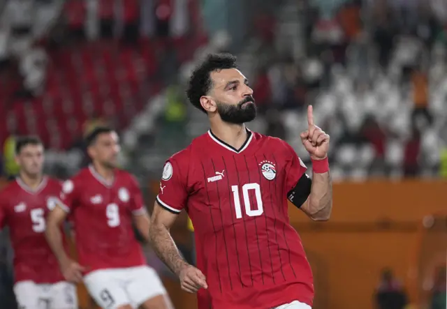 Mohammed Salah celebrates scoring a late penalty for Egypt against Mozambique