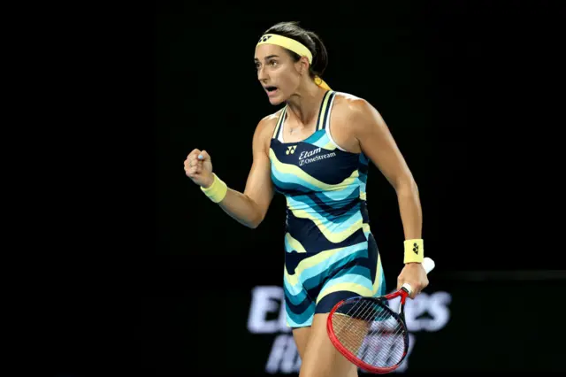 Caroline Garcia pumps her fist in celebration