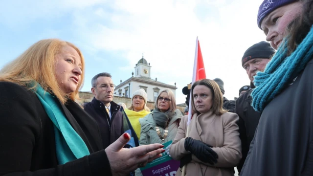 Alliance leader Naomi Long and colleague Andrew Muir meet trade union representatives