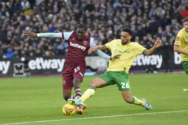 West Ham's Devine Mubama is tackled by Bristol City's Zak Vyner