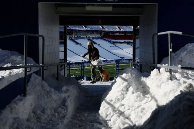 Fans shovelling the snow at Buffalo's Highmarl Stadium