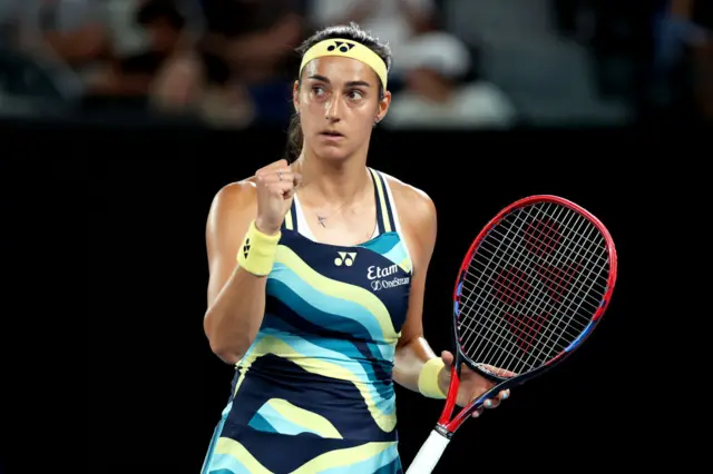 Caroline Garcia pumps her fist in celebration