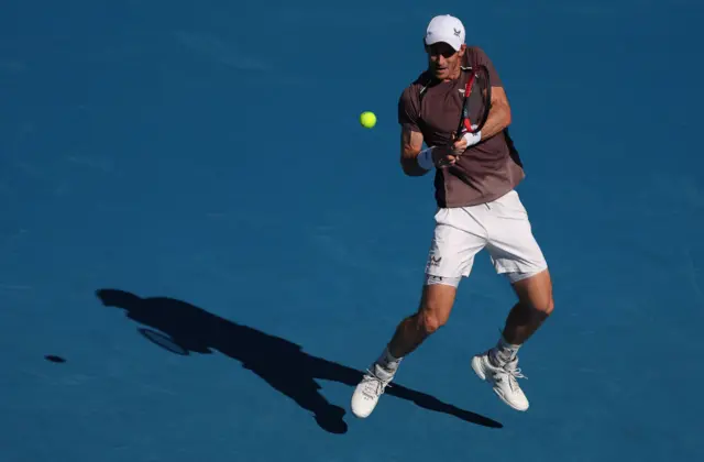 Andy Murray hits a backhand shot