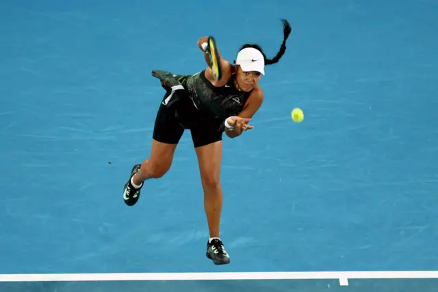 Naomi Osaka serves