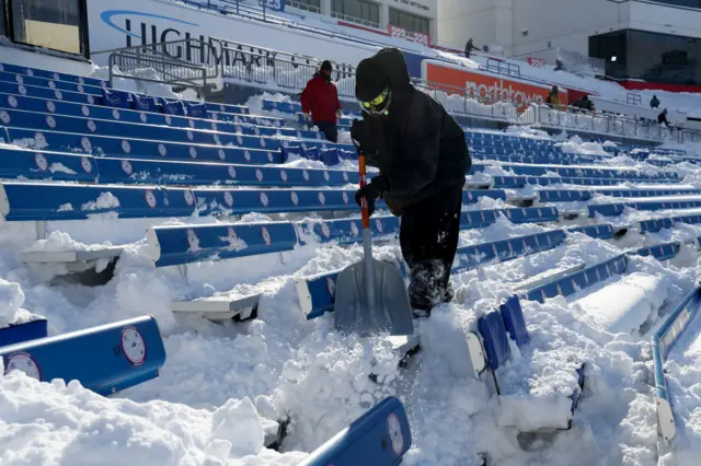 Fans shovelling the snow at Buffalo's Highmarl Stadium