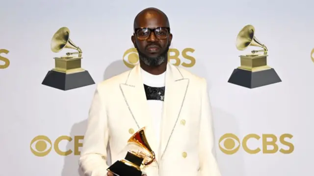 South African DJ Black Coffee holds his Grammy award