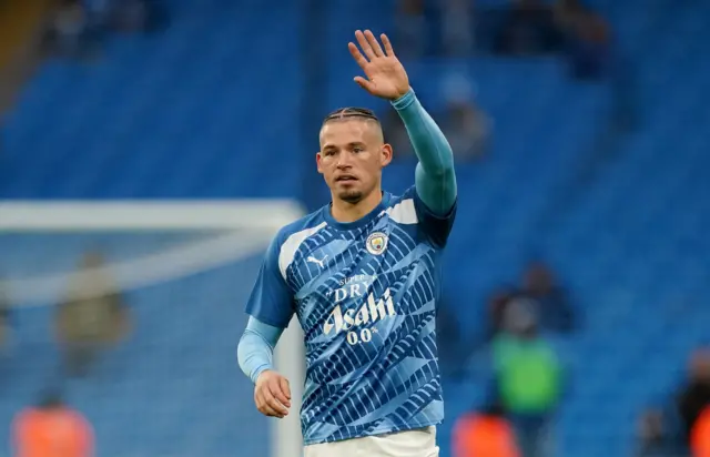 Kalvin Phillips raises his arm to call for the ball during a warm up.