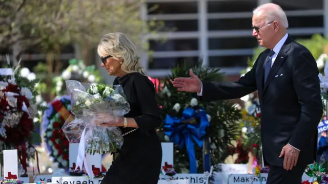 S President Joe Biden and First Lady Jill Biden pay their respects at a makeshift memorial outside of Robb Elementary School in Uvalde, Texas on May 29, 2022.