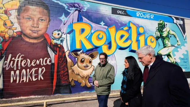 Artist Abel Ortiz gives Attorney General Merrick Garland and Associate Attorney General Vanita Gupta a tour of murals of the Uvalde shooting victims, in Uvalde, Texas, U.S., January 17, 2024. The Justice Department is planning this week to release findings of an investigation into the 2022 school shooting. Eric Gay/Pool via REUTER